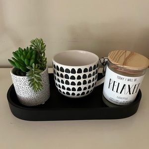 Tray with eucalyptus candle, mug, and faux succulent, black and white th…